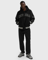 NEW ERA NE HOODED VRSITY JCKT NEWERA 60684379 | Black